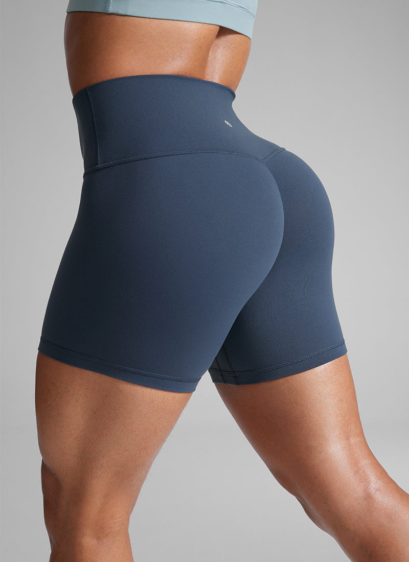 טייץ מחטב+ קצר עם כיווץ בישבן 4" Butterlift Secretsculpt™ ללא תפר קדמי - Stelindigo